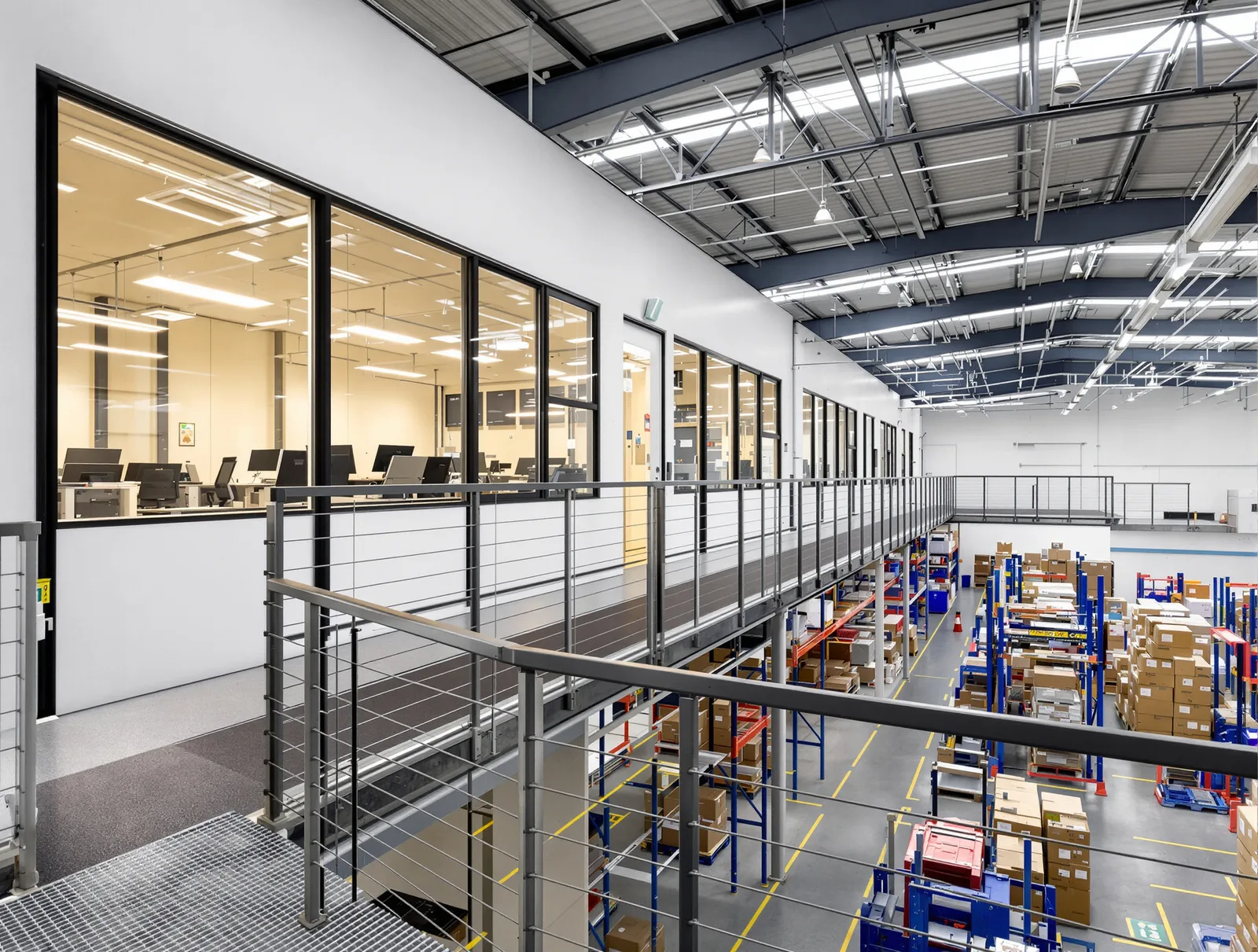Two-storey office and amenities block built inside an operating warehouse