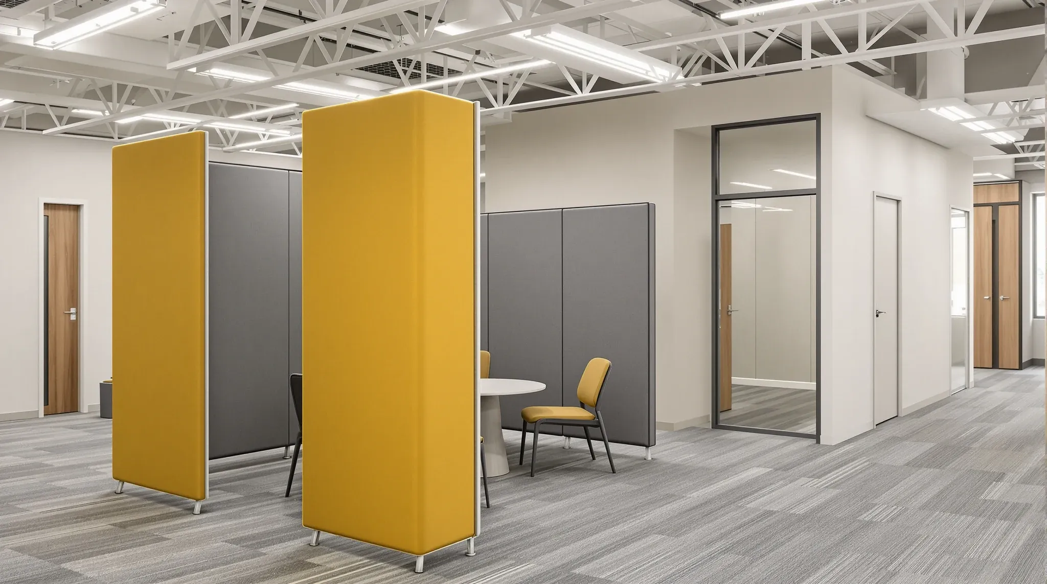 Freestanding fabric screens around a small meeting table beside an enclosed plasterboard meeting room
