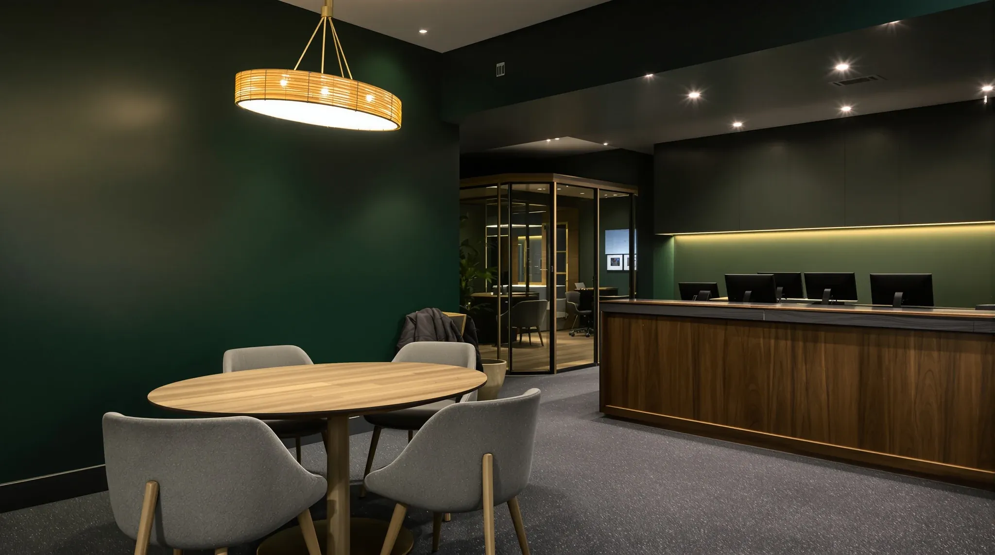 Inside a real estate office after closing, with a client meeting table and a row of agent desks