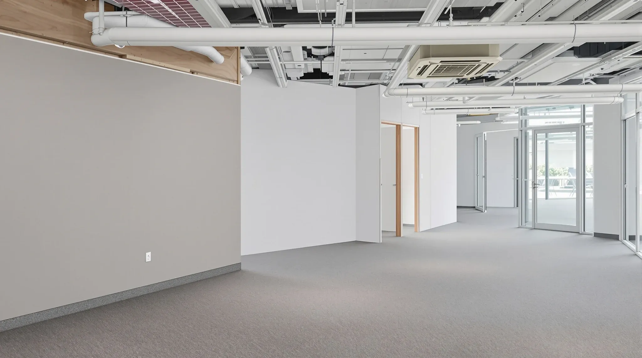 A mid fit-out floor showing partition, ceiling and flooring work side by side