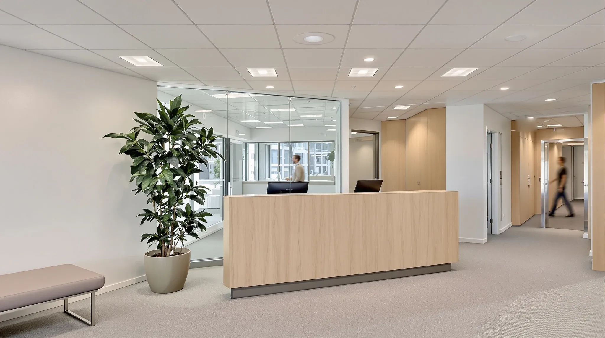 A neutral, well-kept tenancy reception in an office tower in the morning