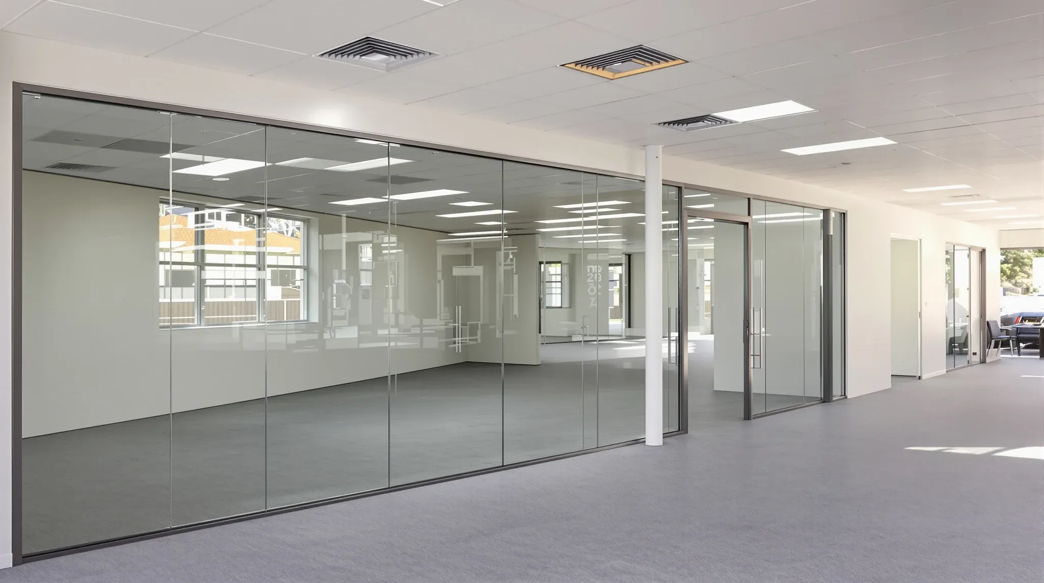 Empty finished subdivided office floor with a new demising glass wall and separate entry