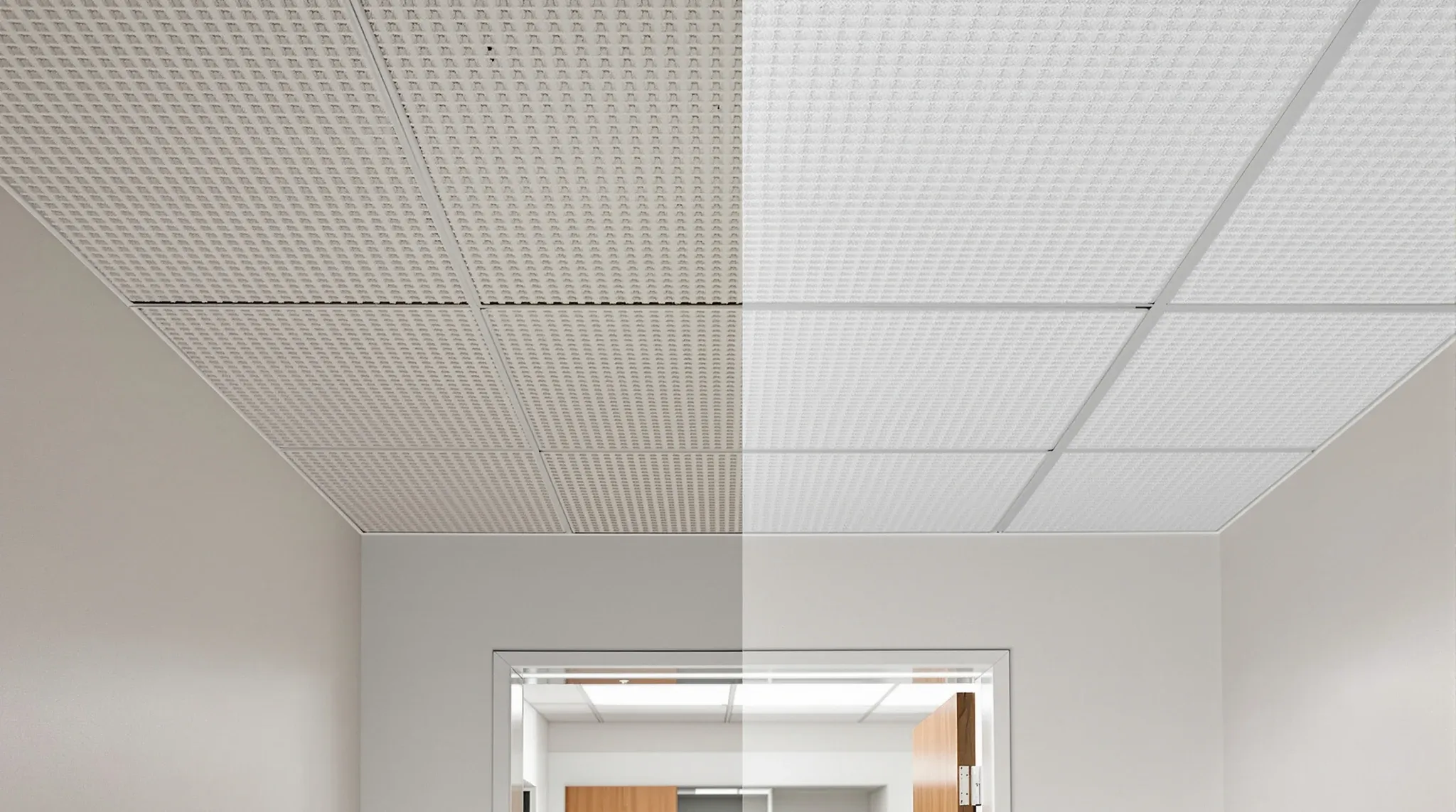 A doorway where an older ceiling grid meets a newly replaced ceiling grid