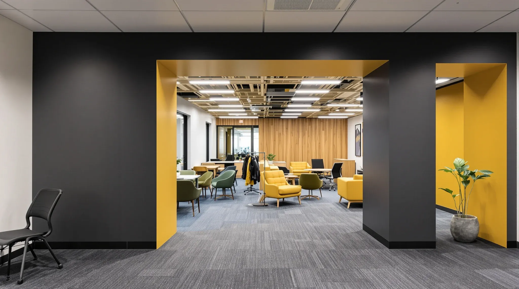 A wide new opening in an old dividing wall joining two differently furnished offices