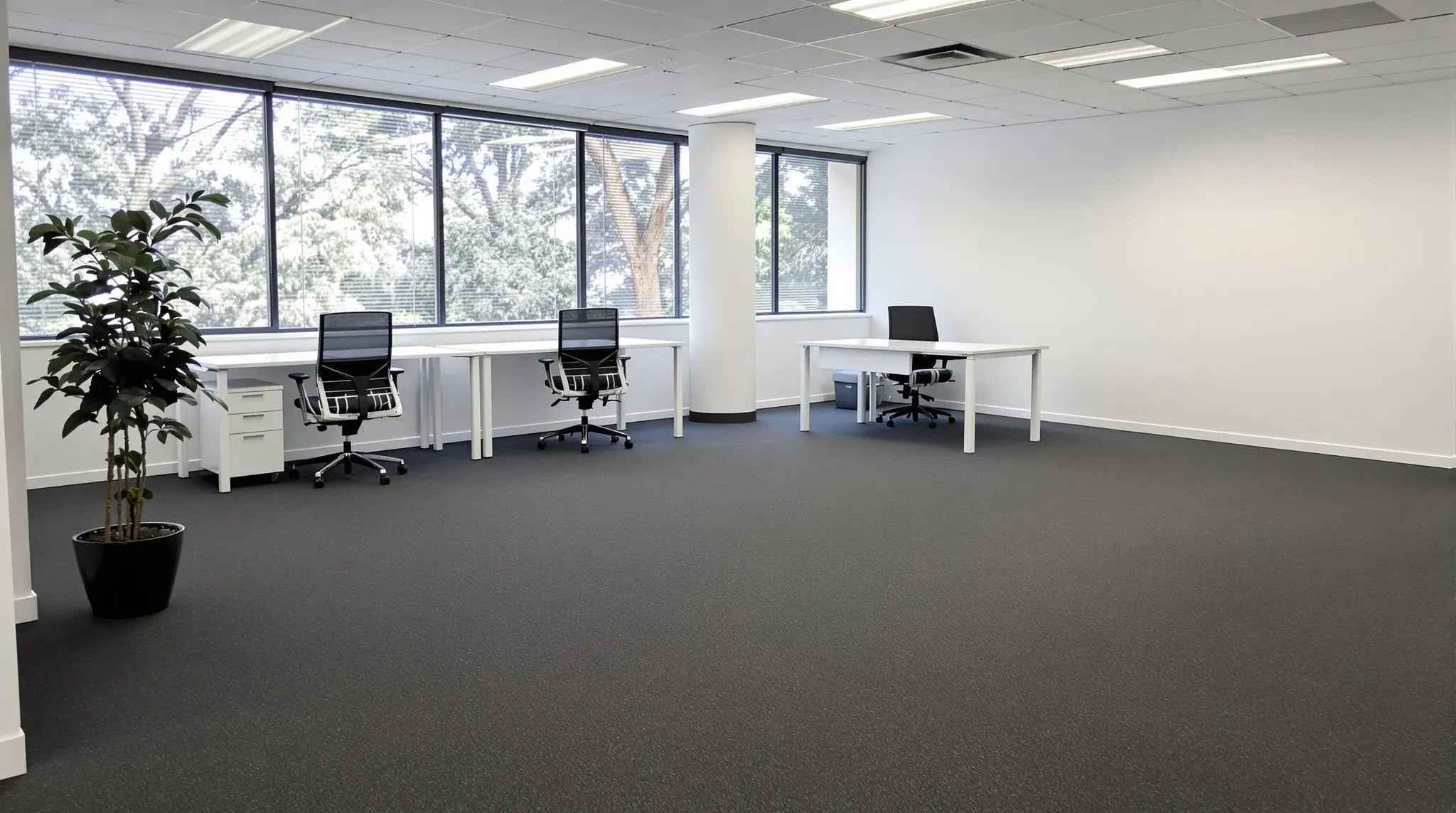The first group of new desks assembled on an otherwise empty office floor in early morning light