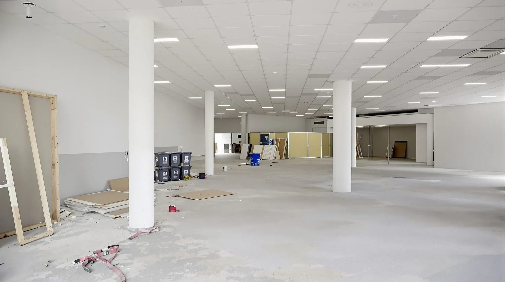 A commercial floor mid defit alongside a cleared section ready for the next fit-out