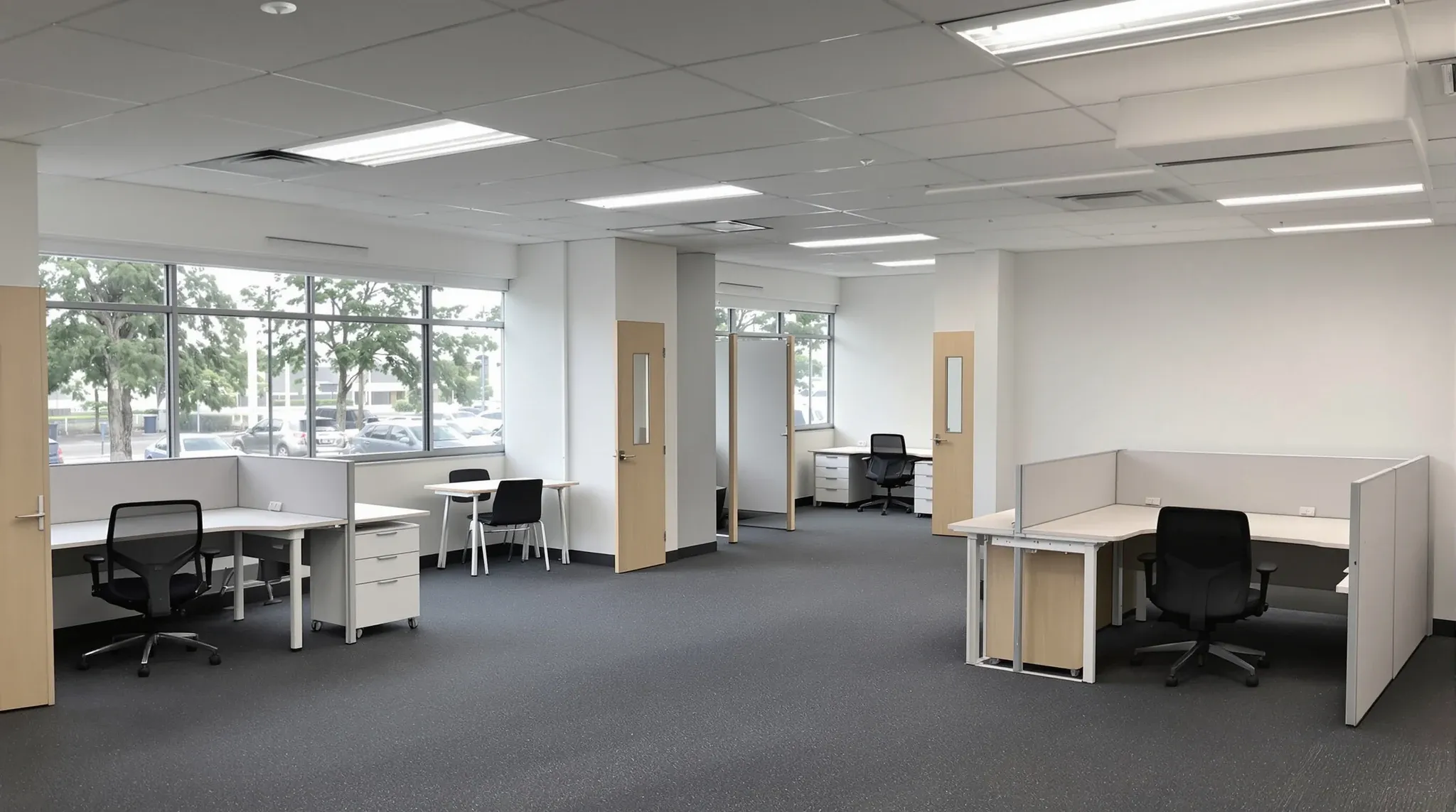 An emptied but intact office fitout in a business park, with offices and workstations left in place
