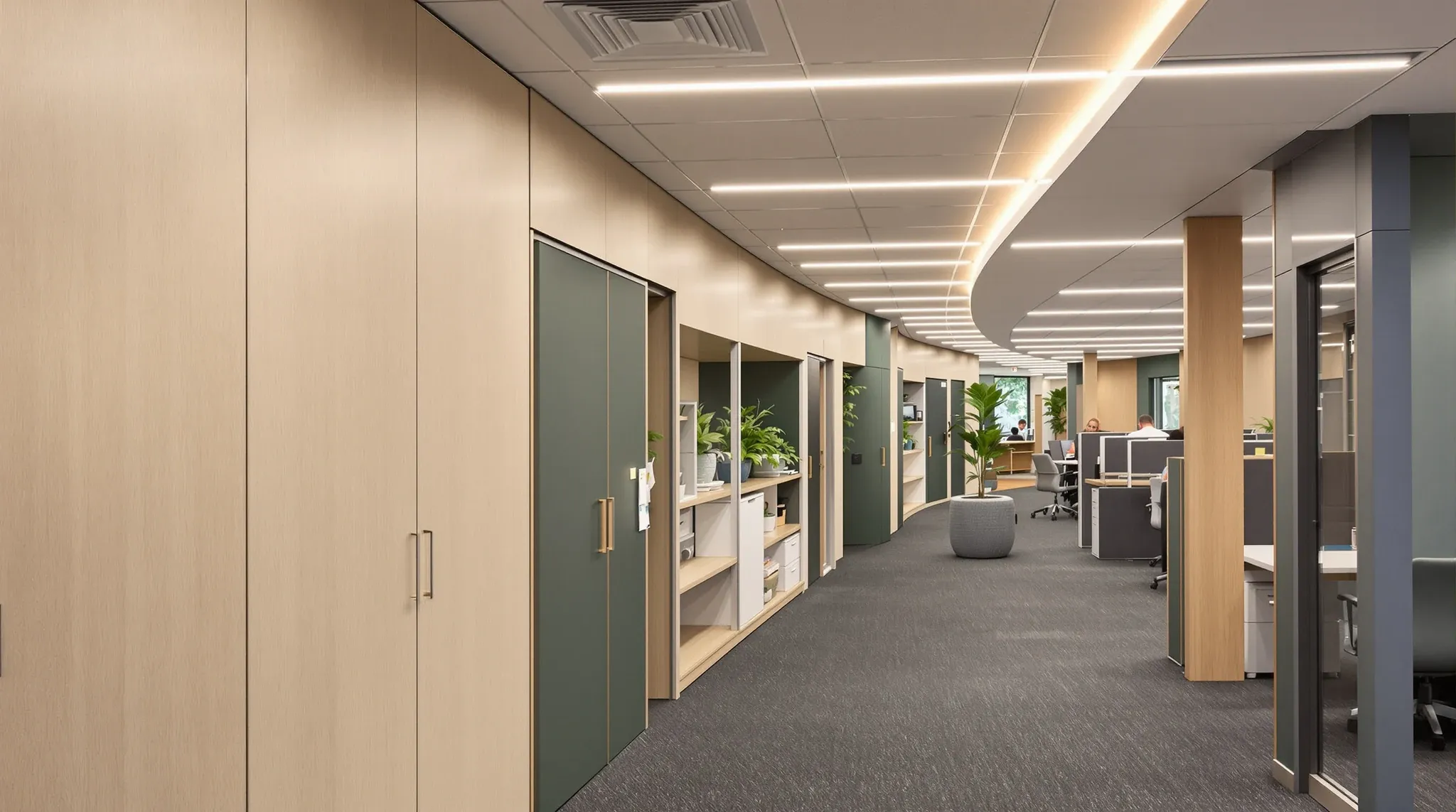 A completed office fitout with a long timber storage wall, meeting rooms and workstations in use