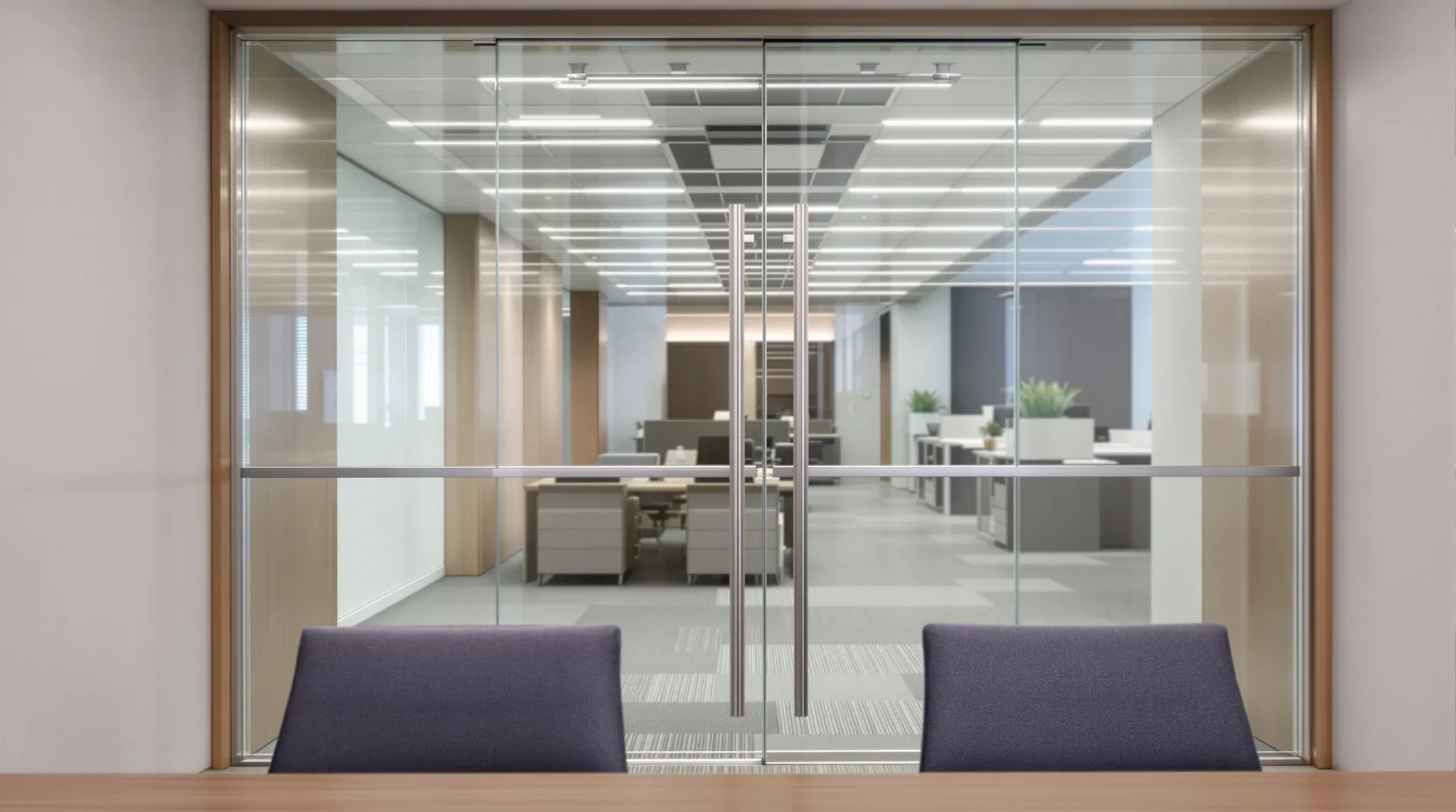 A frameless glass boardroom door with slim steel top and bottom rails, seen from inside the room