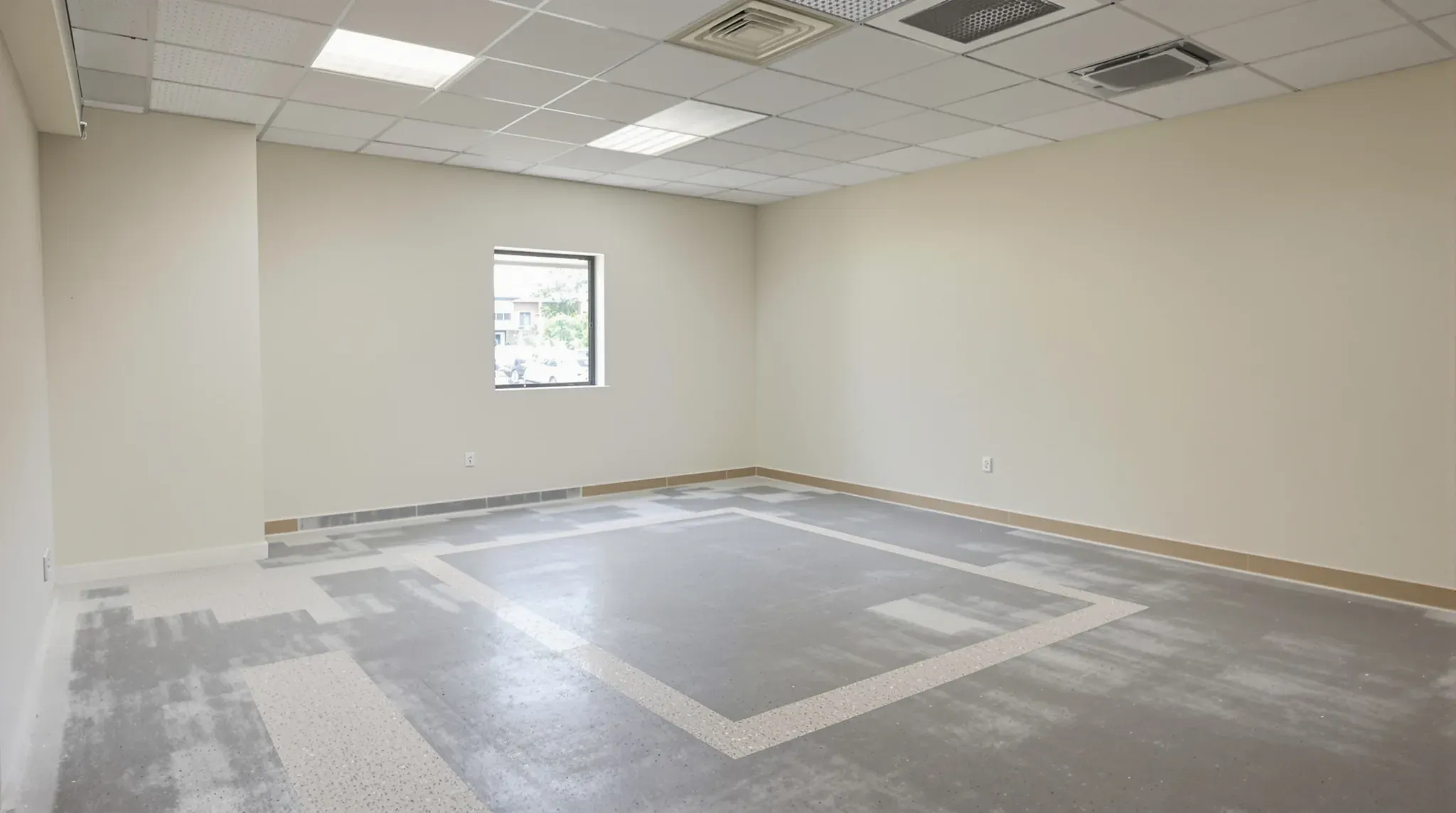 Empty former dental surgery after make good, with a patched floor, painted walls and a window