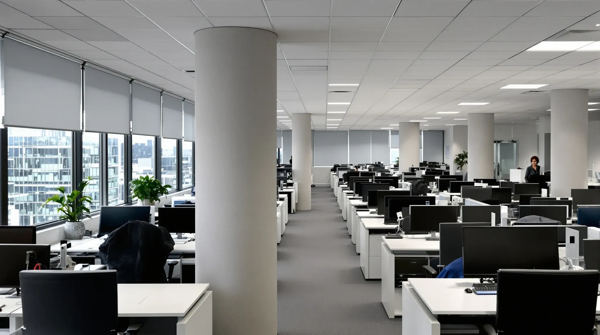 A tightly planned office floor in an older city tower, with the neighbouring building just metres away